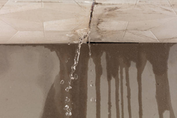 Professional Flood Damage Cleanup technician working in Sutton, MA